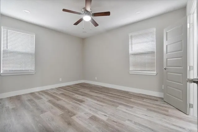 a view of room with window and ceiling fan