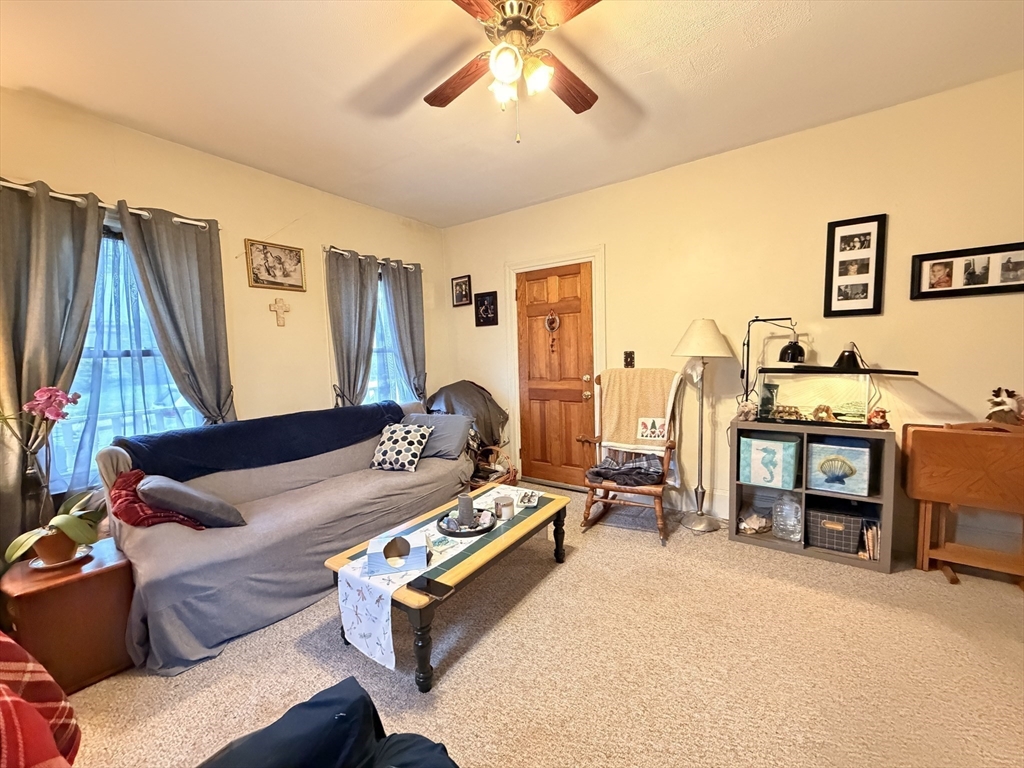 12 Whitcomb Street Webster, MA 01570 - Photo 33 of 40 a living room with furniture and a flat screen tv