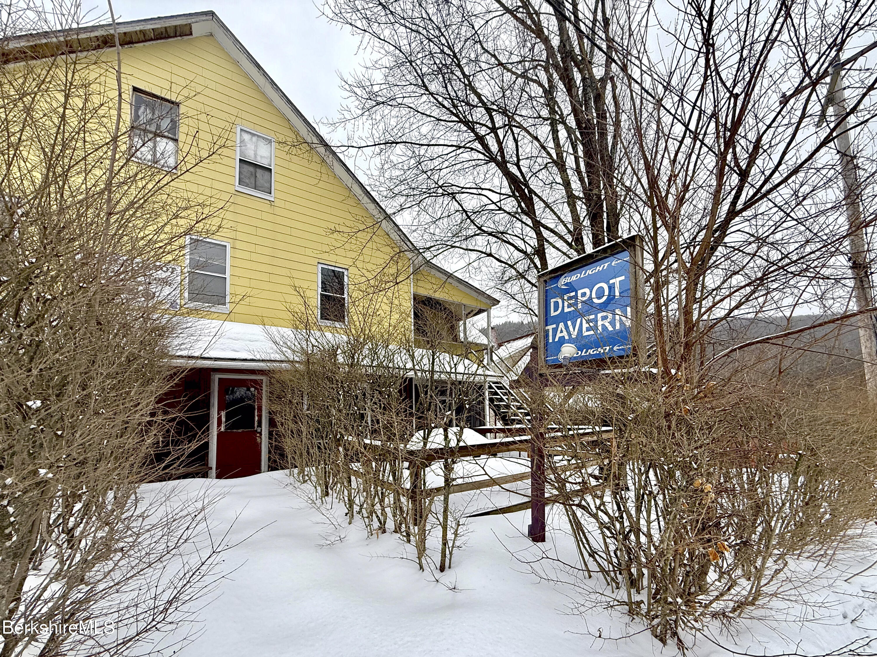 a view of a chairs and tables in the patio