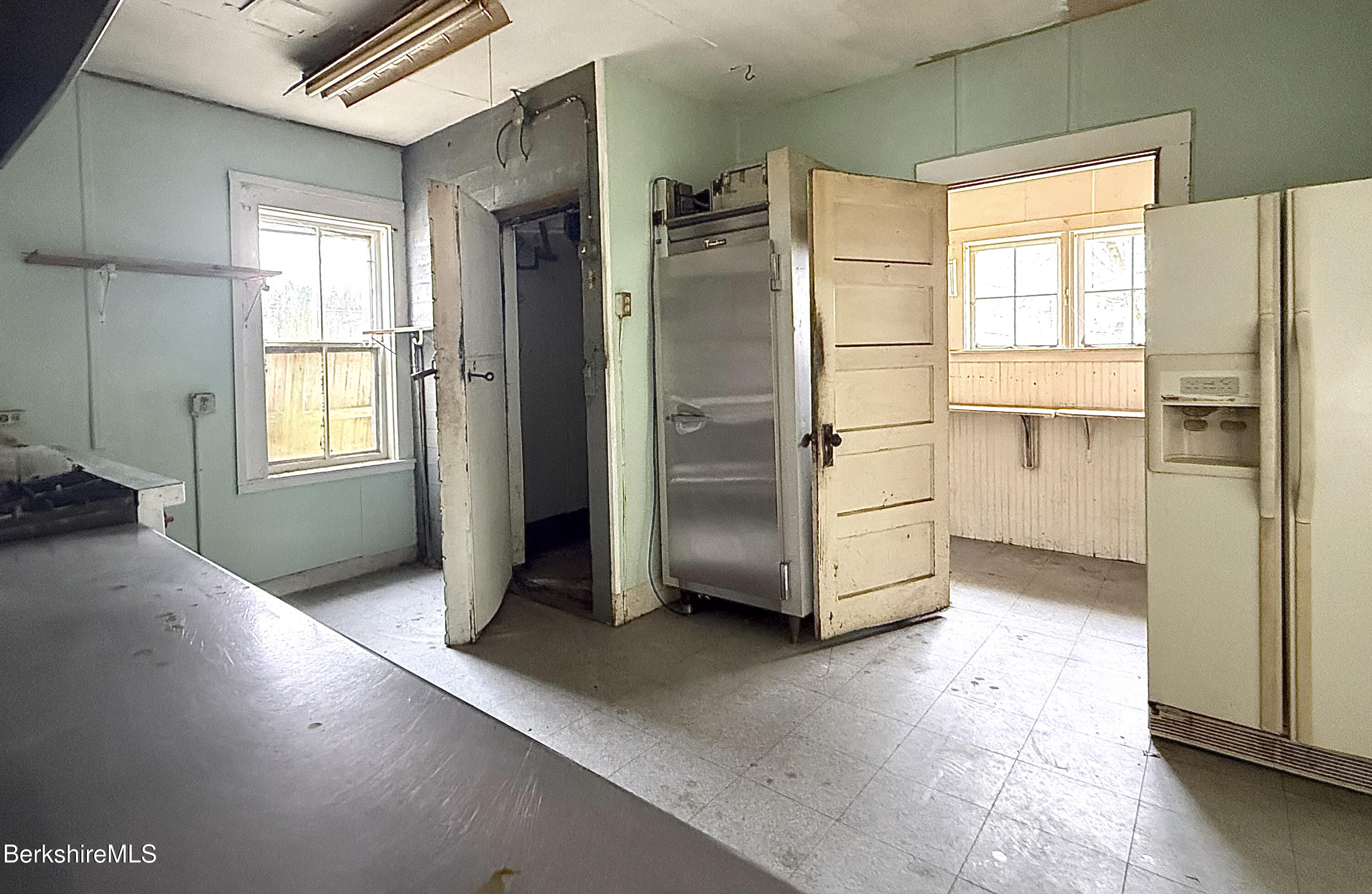 9 Depot Street Monroe, MA 01350 - Photo 21 of 30 a kitchen with stainless steel appliances a refrigerator and a stove top oven