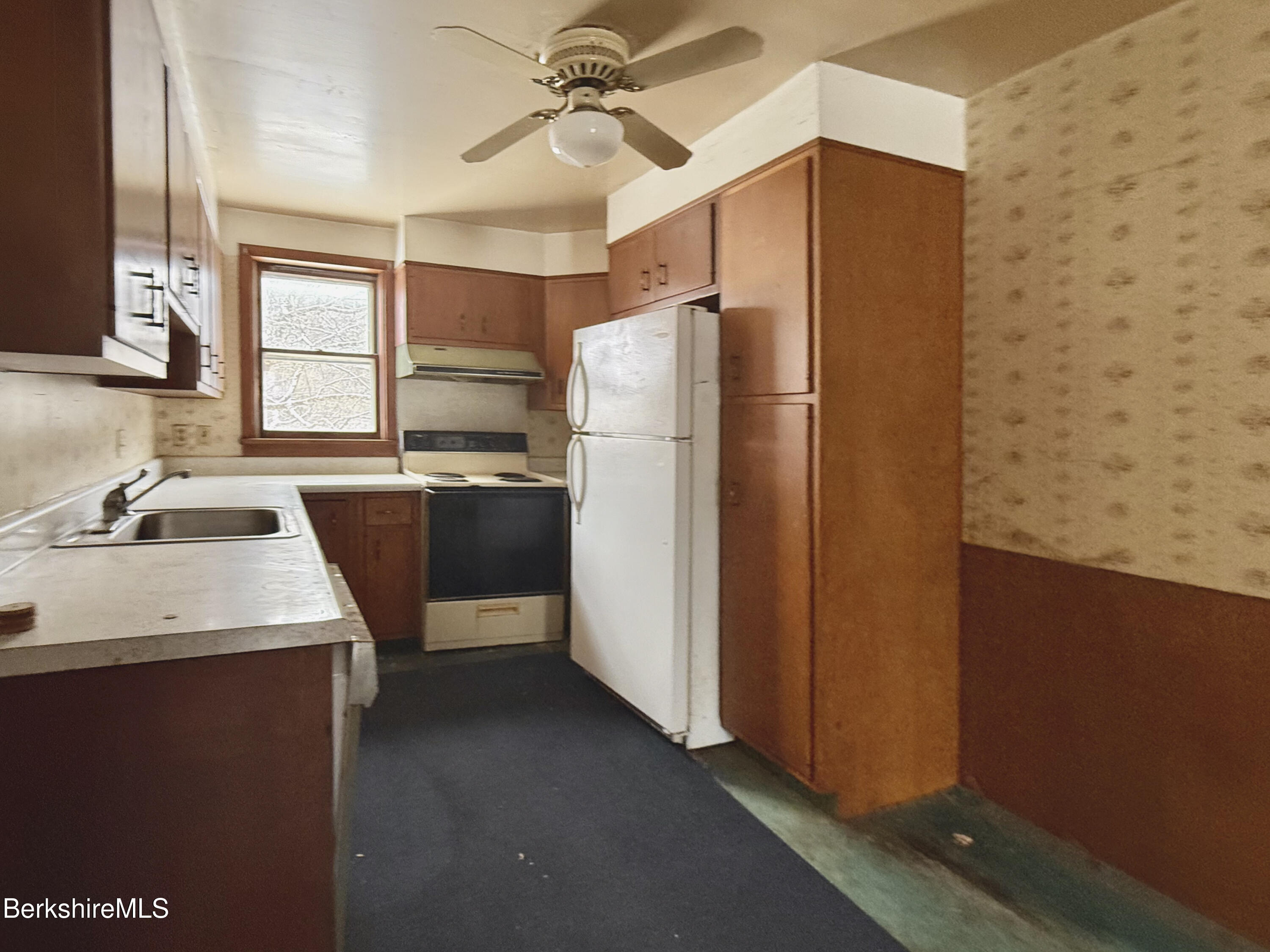 9 Depot Street Monroe, MA 01350 - Photo 3 of 30 a kitchen with stainless steel appliances a refrigerator and a sink