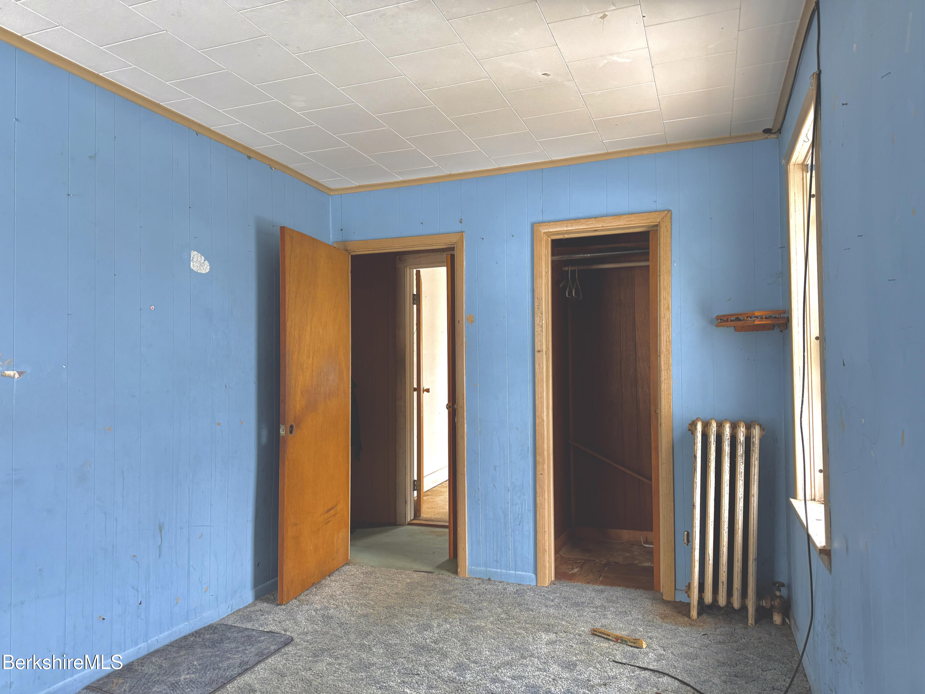 9 Depot Street Monroe, MA 01350 - Photo 7 of 30 a view of a hallway with wooden walls