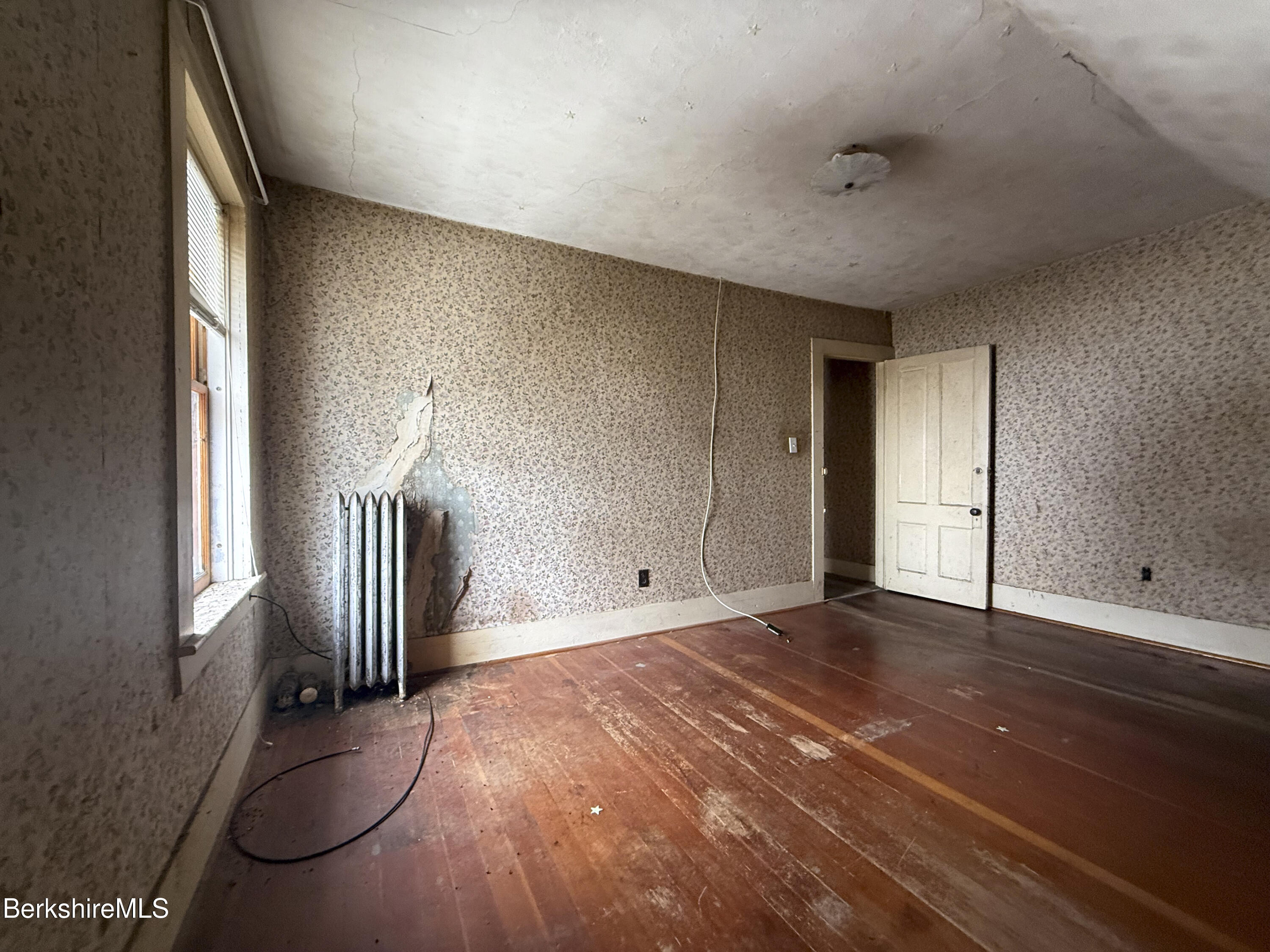 9 Depot Street Monroe, MA 01350 - Photo 9 of 30 a view of empty room with wooden floor