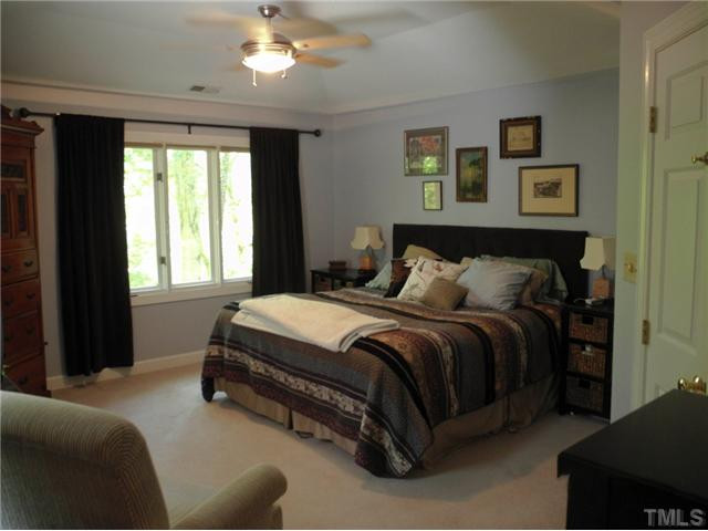 12129 Warwickshire Way Raleigh, NC 27613 - Photo 16 of 24 *Master Bedroom w/ Gorgeous Wooded View*