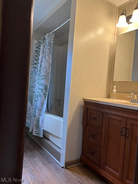 10157 Ravenna Road Chardon, OH 44024 - Photo 23 of 34 Bathroom with vanity, shower / tub combo, and hardwood / wood-style floors