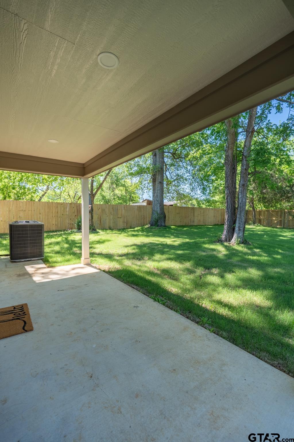 233 Harrison Street Longview, TX 75601 - Photo 40 of 44 a view of a house with a yard and a sitting area