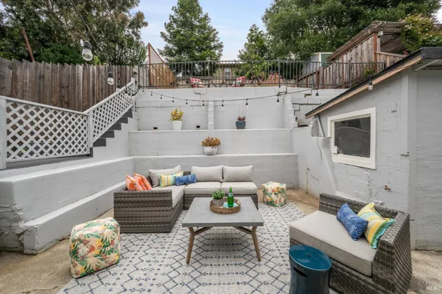 a backyard of a house with sofas