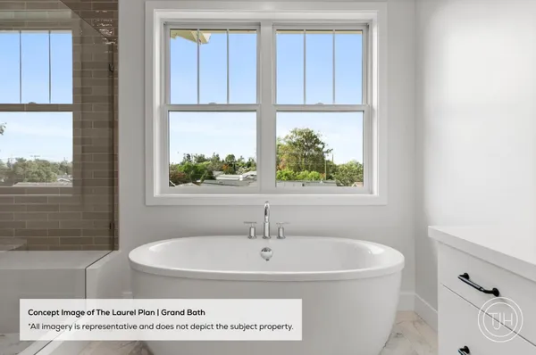 a bath tub sitting next to a window