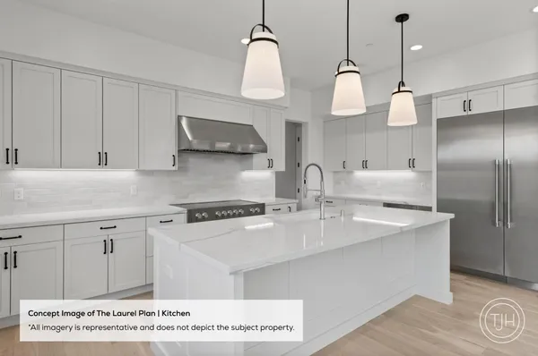 a kitchen with kitchen island a sink stainless steel appliances and cabinets