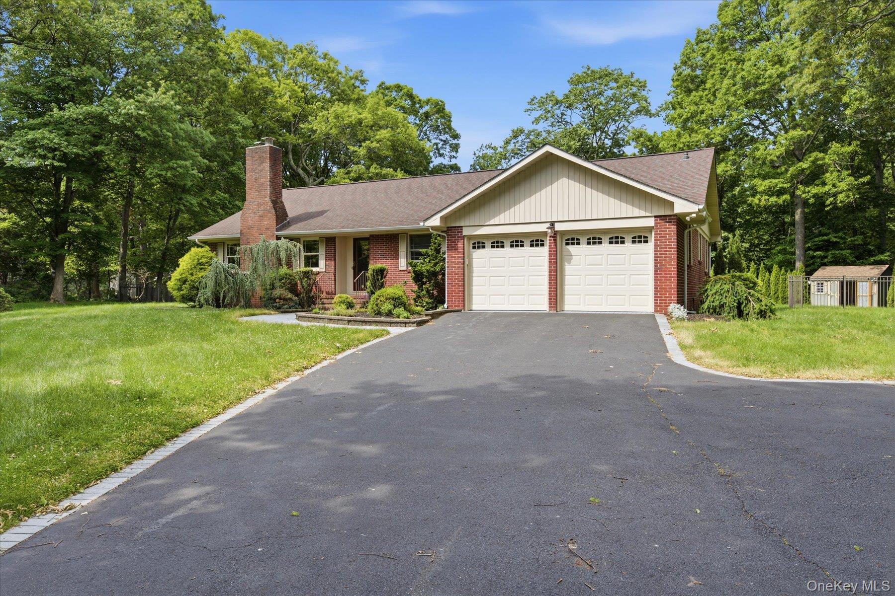 42 Cliff Road Port Jefferson, NY 11777 - Photo 2 of 22 a view of a house with a yard and large trees