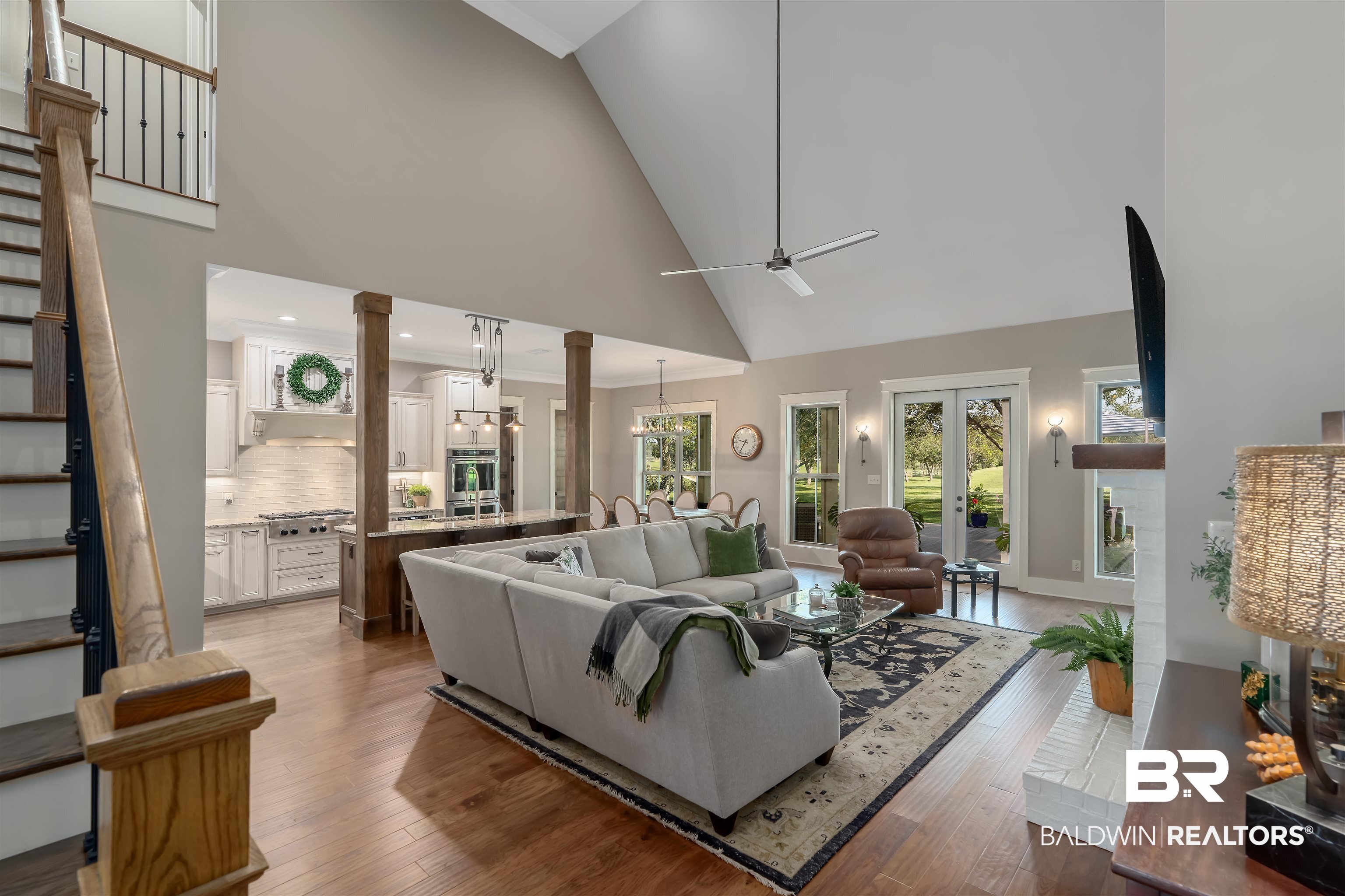 8753 Bishop Road Fairhope, AL 36532 - Photo 21 of 59 Vaulted great room with hardwood-finish flooring and a ceiling fan