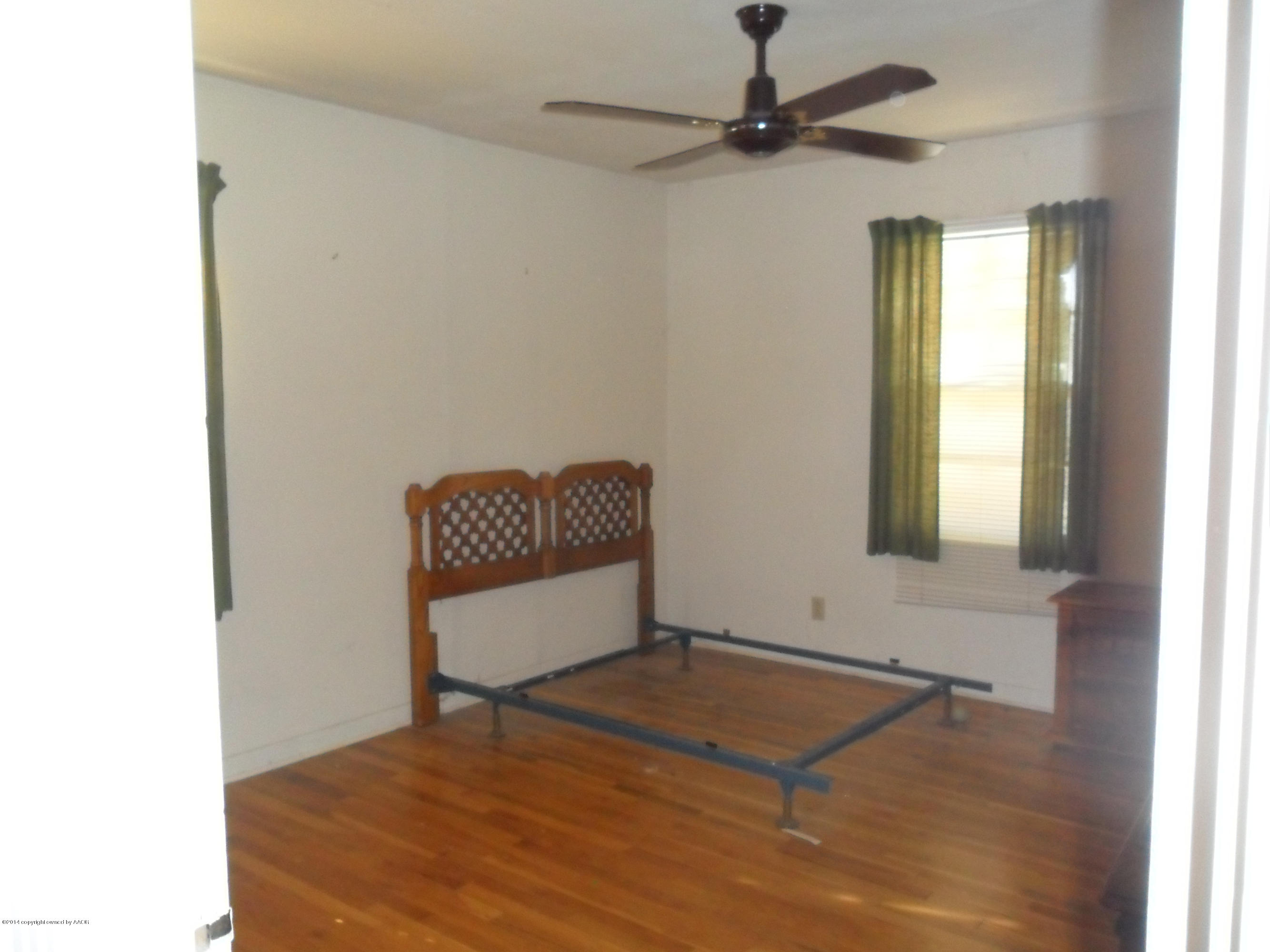 4606 Preston Street Amarillo, TX 79110 - Photo 5 of 10 a room with a window and a ceiling fan