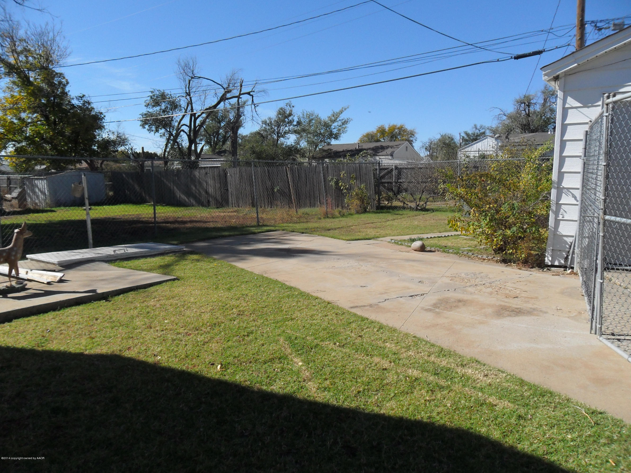 4606 Preston Street Amarillo, TX 79110 - Photo 8 of 10 a view of a backyard with trampoline