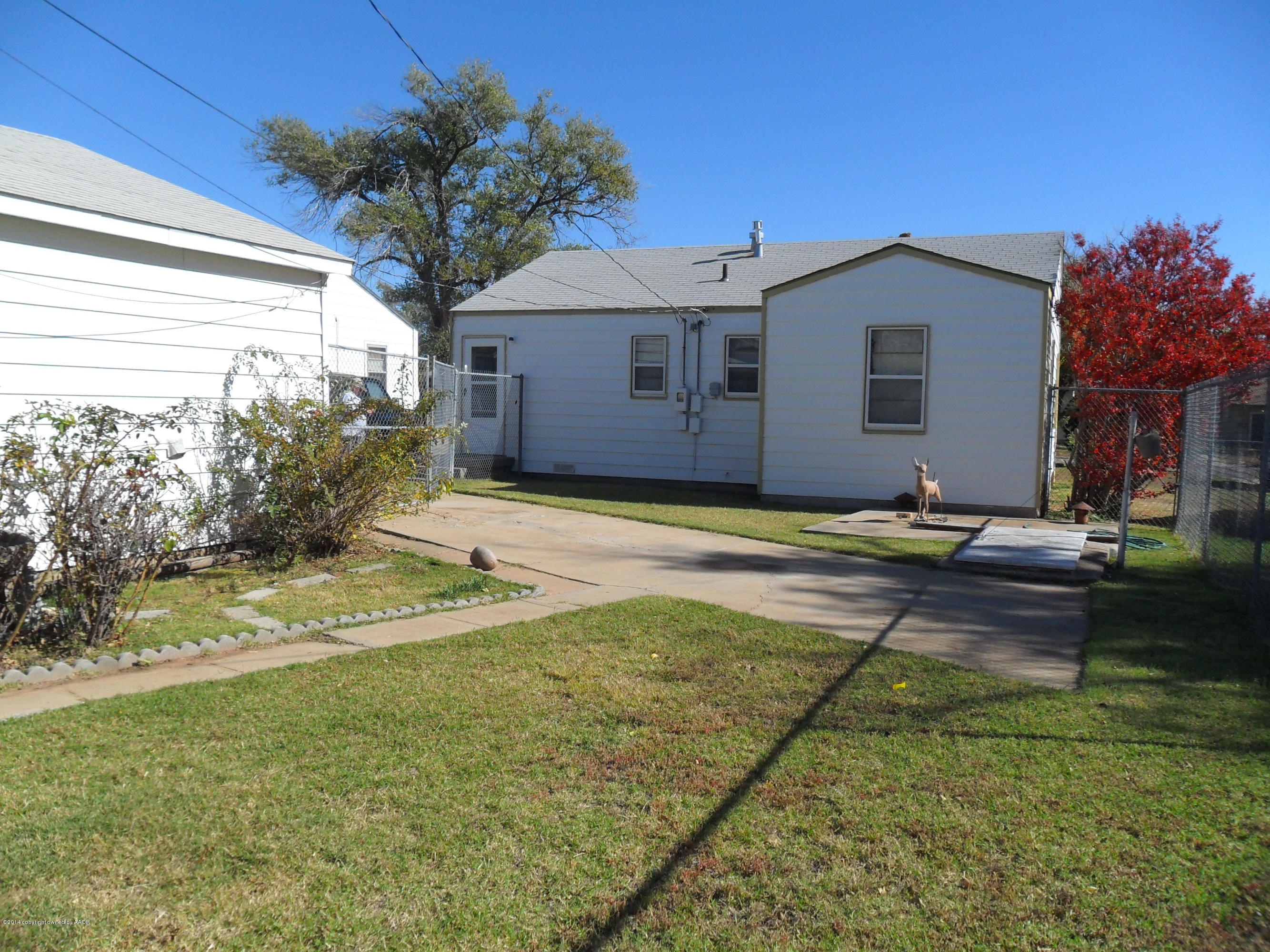 4606 Preston Street Amarillo, TX 79110 - Photo 9 of 10 a view of a house with a yard