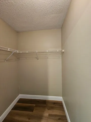 a view of room with racks on the wall