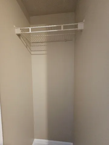 a view of a room with racks on the wall