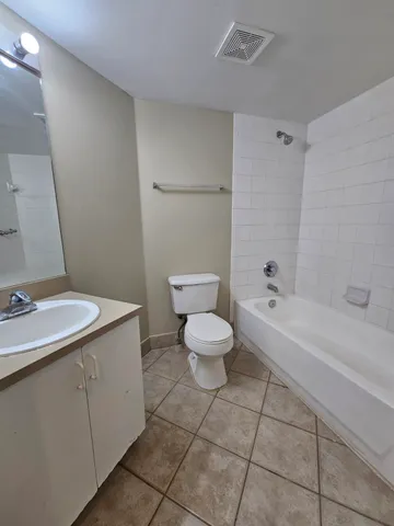 a bathroom with a sink a toilet and a bathtub