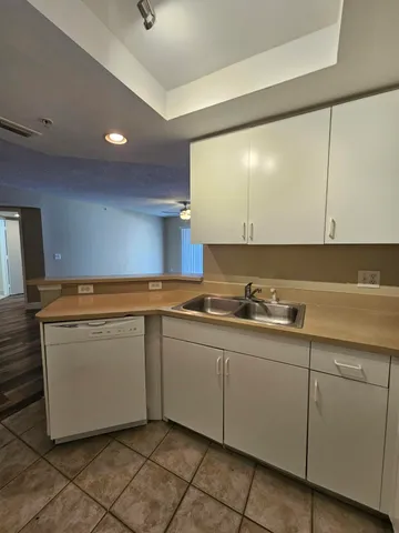 a kitchen with a sink and cabinets