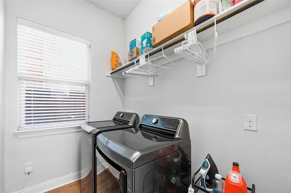a view of storage and utility room with a window