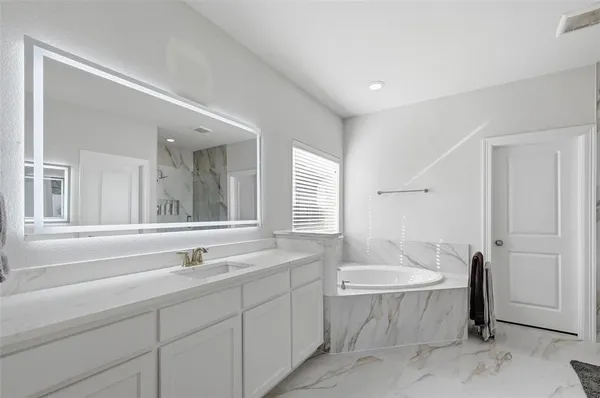 a bathroom with a sink and a bathtub
