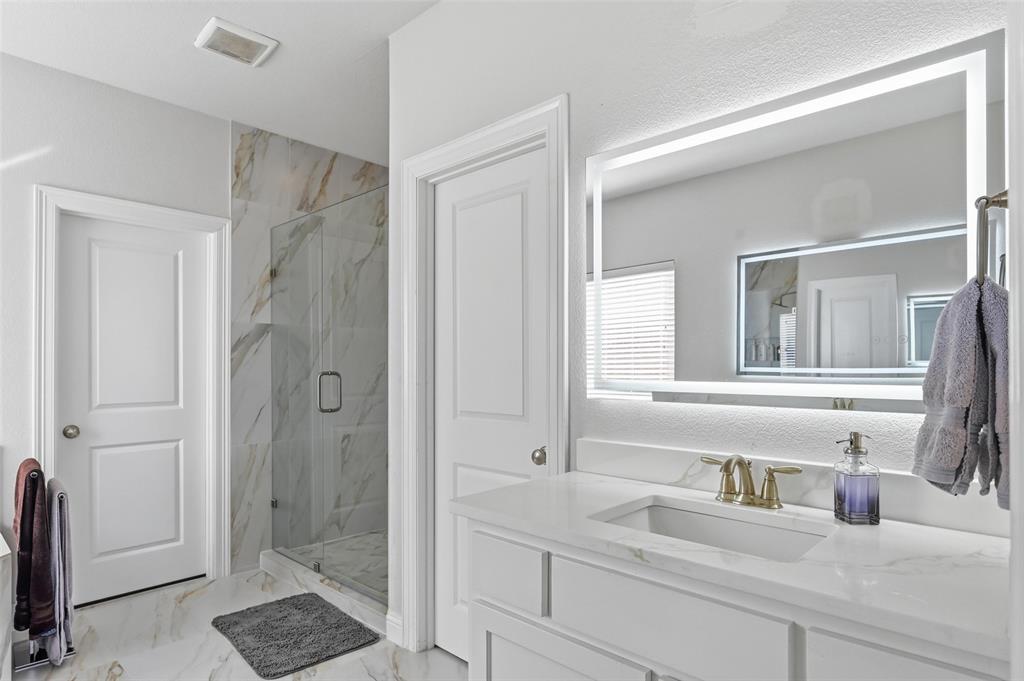 1074 James Court Allen, TX 75013 - Photo 16 of 22 a bathroom with a sink and a mirror