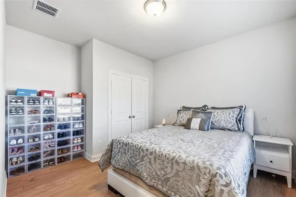 a bedroom with a bed and a chair