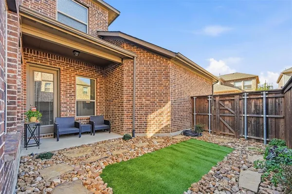a backyard of a house with seating space