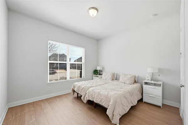 a bedroom with a bed and window