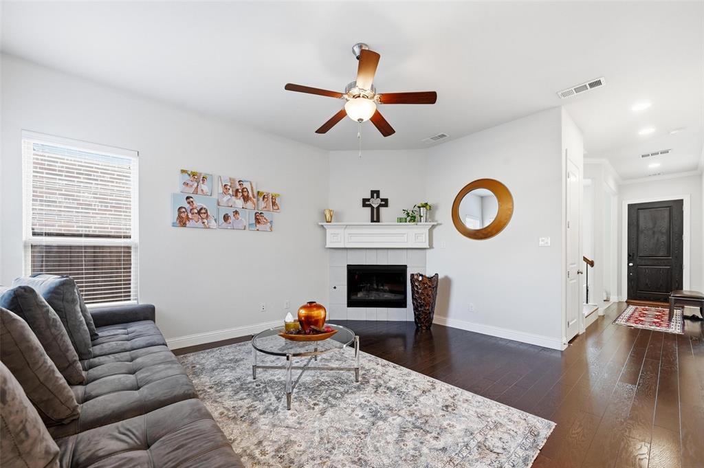 1074 James Court Allen, TX 75013 - Photo 6 of 22 a living room with furniture flat screen tv and a fireplace