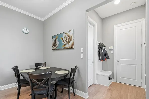 a view of a dining room with furniture and wooden floor