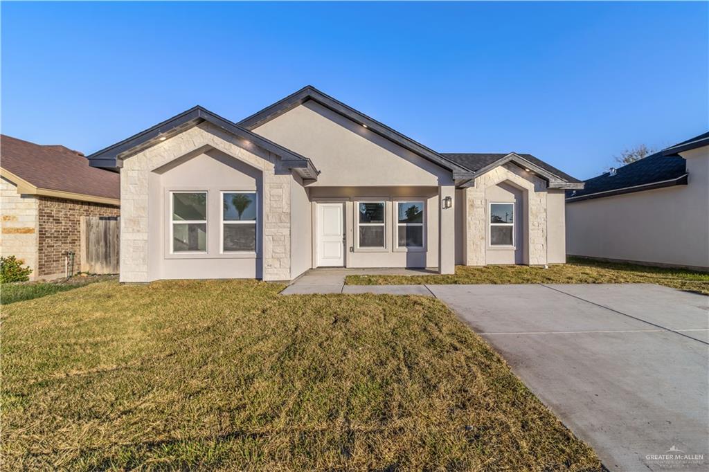 8101 South Morelos Street Pharr, TX 78577 - Photo 1 of 1 front view of a house with a yard