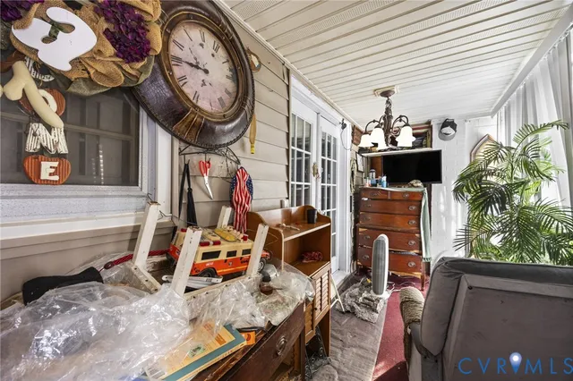 a view of a livingroom with furniture and windows
