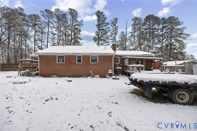 a view of a dry yard with wooden fence