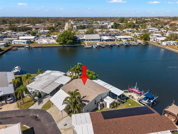 an aerial view of a house with a ocean view