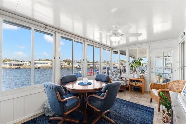 a view of a dining room with furniture window and outdoor view
