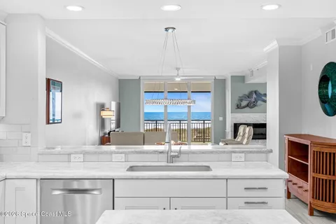 a kitchen with stainless steel appliances granite countertop a stove and cabinets