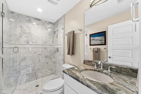a utility room with sink dryer and washer