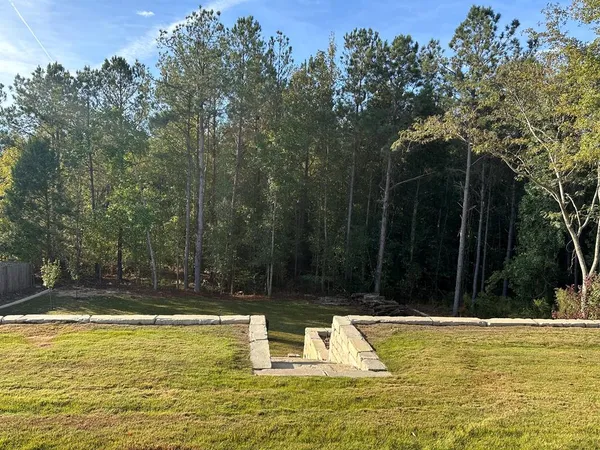 a view of swimming pool with a yard