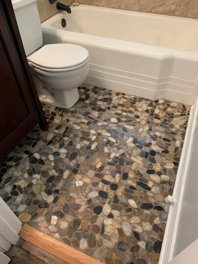 3208 33rd Street Lubbock, TX 79410 - Photo 5 of 14 a bathroom with a toilet and a shower