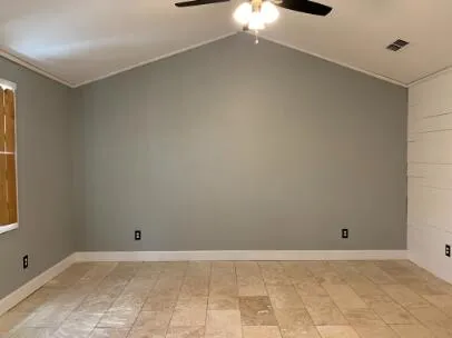 a view of an empty room with a window