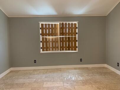 3208 33rd Street Lubbock, TX 79410 - Photo 9 of 14 a view of an empty room with a window