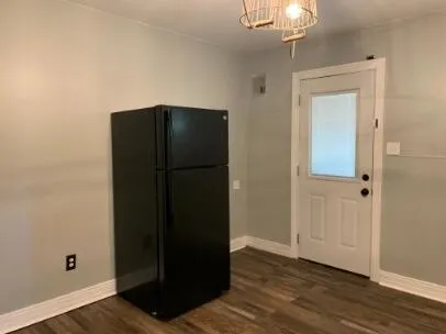 an empty room with wooden floor