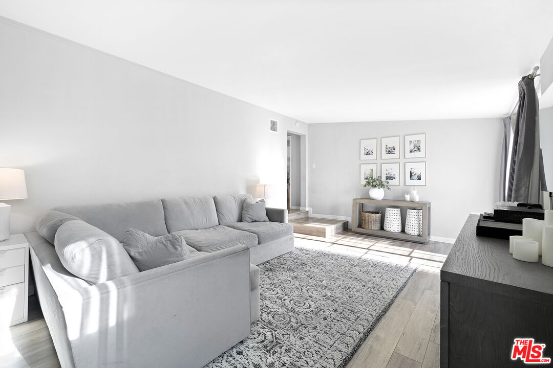 6521 Balcom Avenue Reseda, CA 91335 - Photo 12 of 35 a living room with furniture and a couch