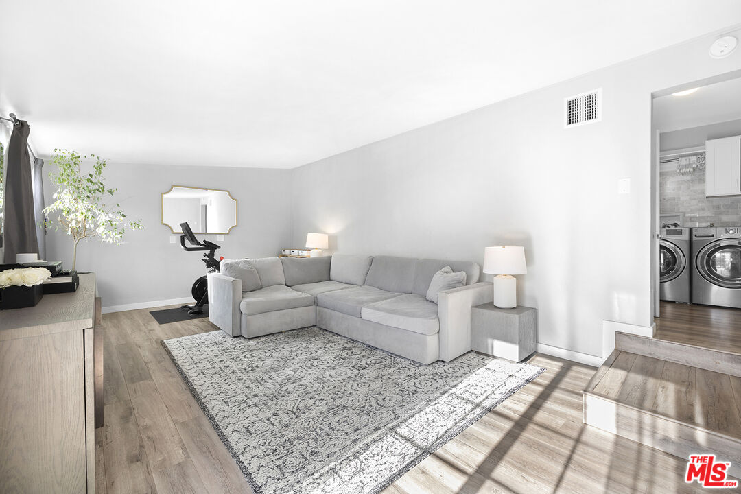 6521 Balcom Avenue Reseda, CA 91335 - Photo 14 of 35 a living room with furniture and a flat screen tv