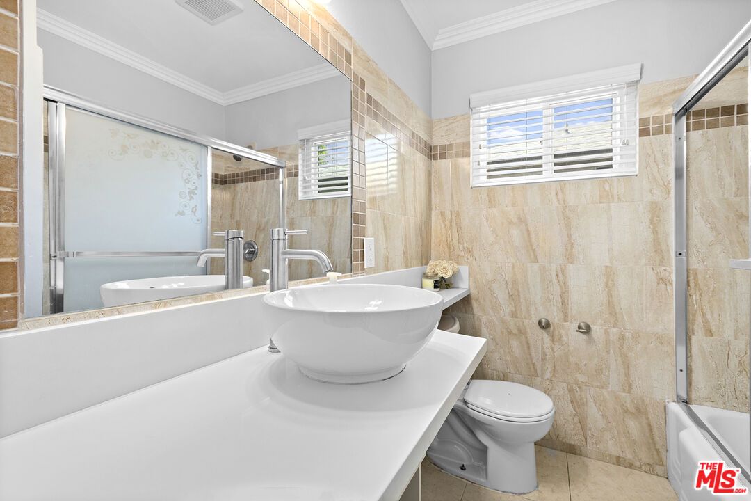 6521 Balcom Avenue Reseda, CA 91335 - Photo 21 of 35 a bathroom with a toilet a sink and a bathtub