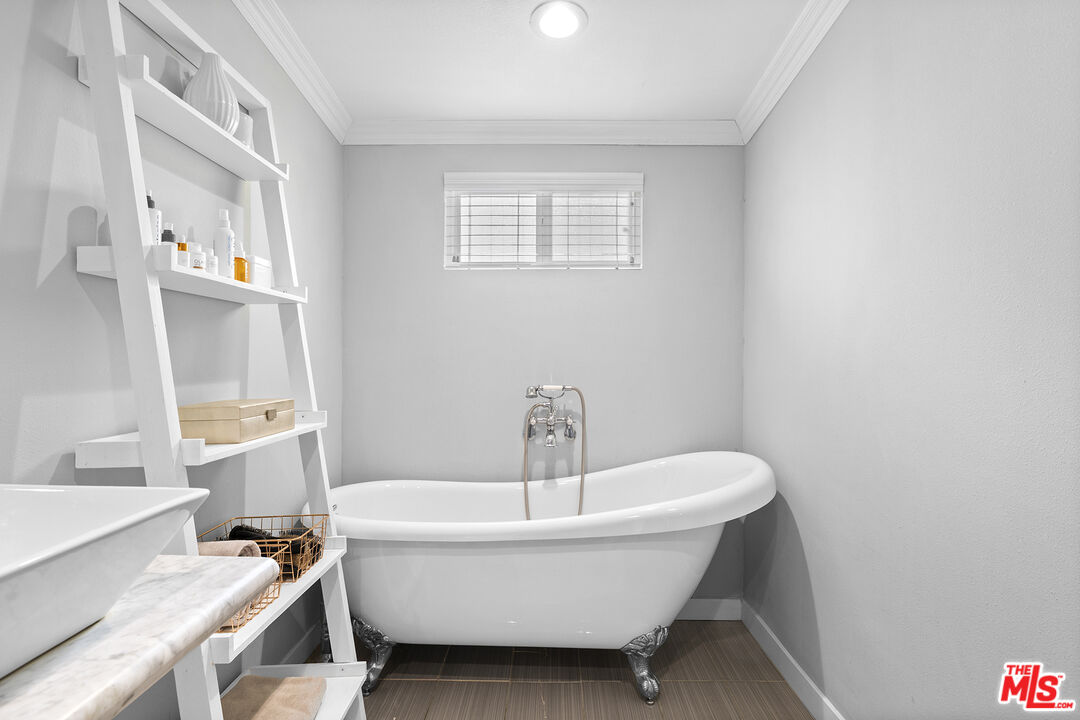 6521 Balcom Avenue Reseda, CA 91335 - Photo 26 of 35 a white bath tub sitting next to a white sink