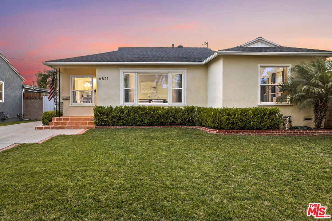 6521 Balcom Avenue Reseda, CA 91335 - Photo 33 of 35 a front view of a house with garden