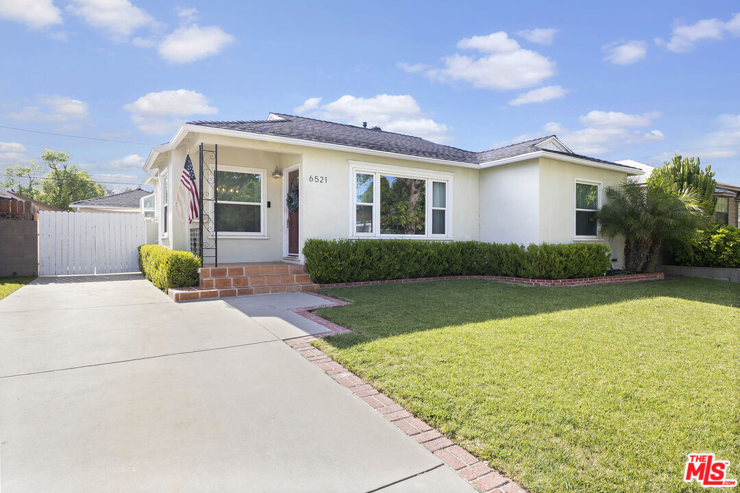 6521 Balcom Avenue Reseda, CA 91335 - Photo 4 of 35 a front view of a house with garden