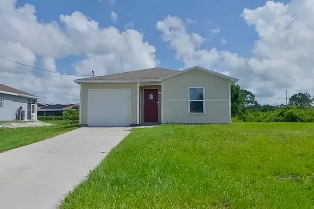 a front view of house with yard and green space