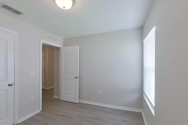 a view of an empty room and window